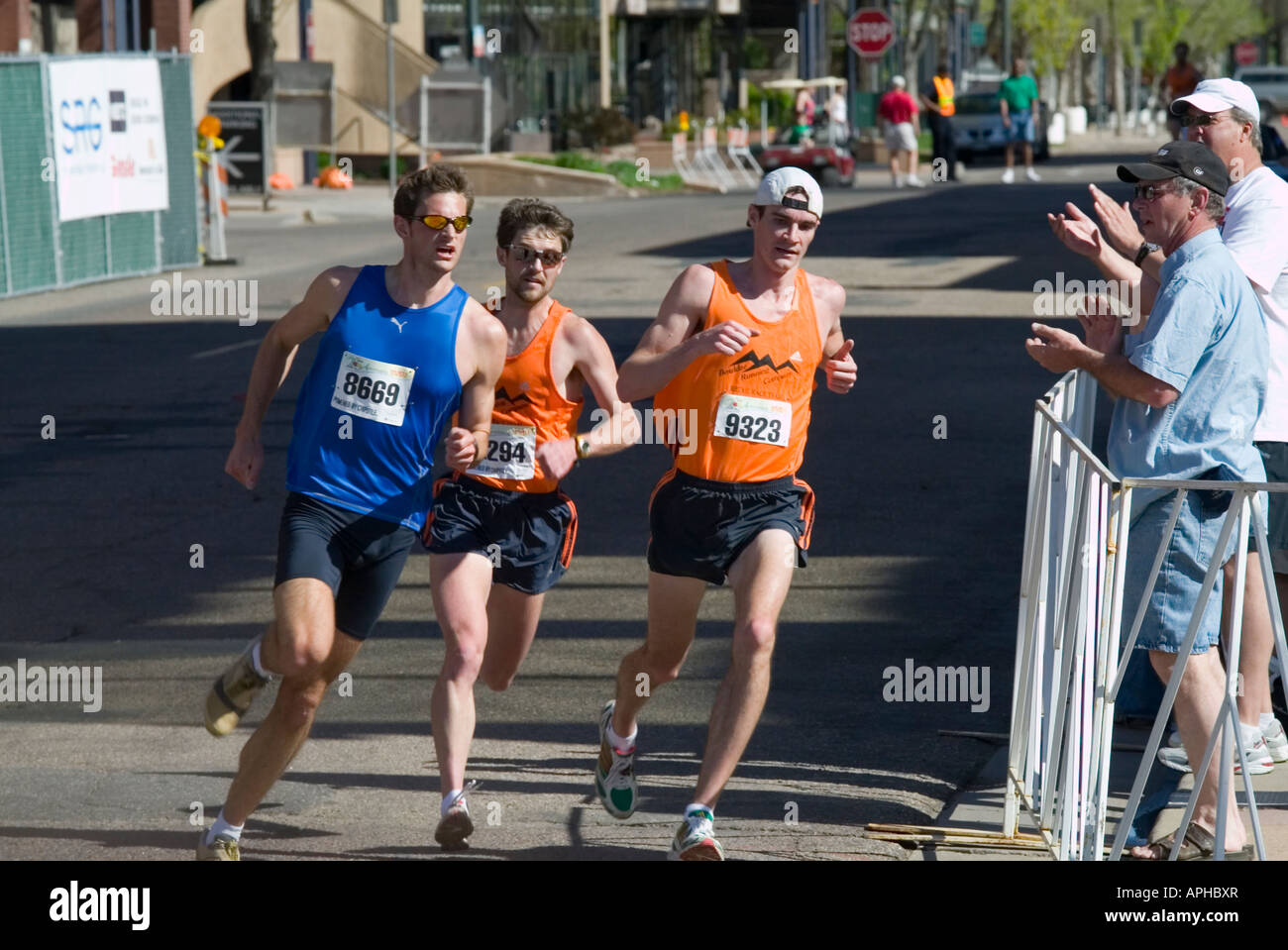 Elite racers at the 25th annual Cherry Creek Sneak 8K run in the Cherry Creek shopping district of Denver Colorado Stock Photo