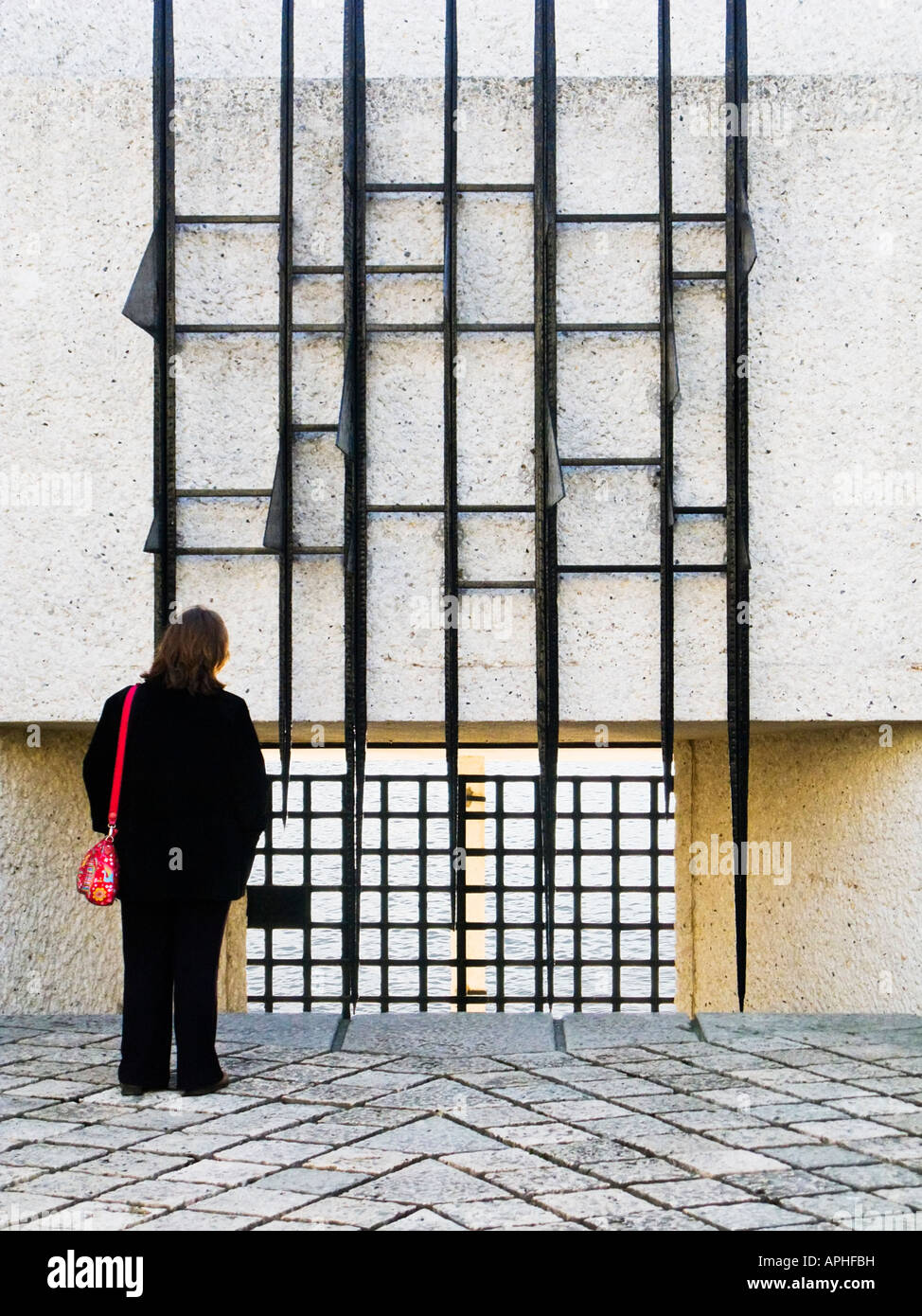 Woman paying respects at the Martyrs Francais de la Deportation memorial Ile de la Cite Paris France Europe Stock Photo
