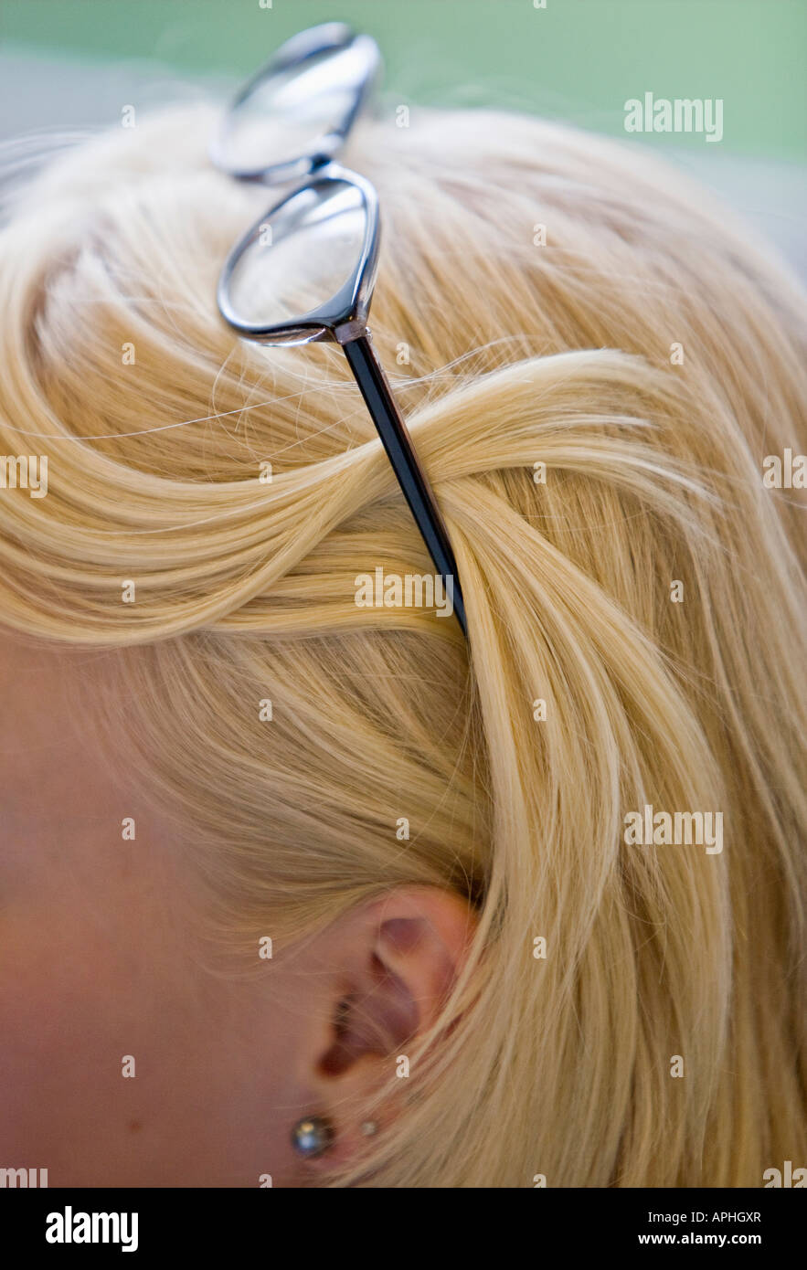 Glasses in blond hair. Stock Photo