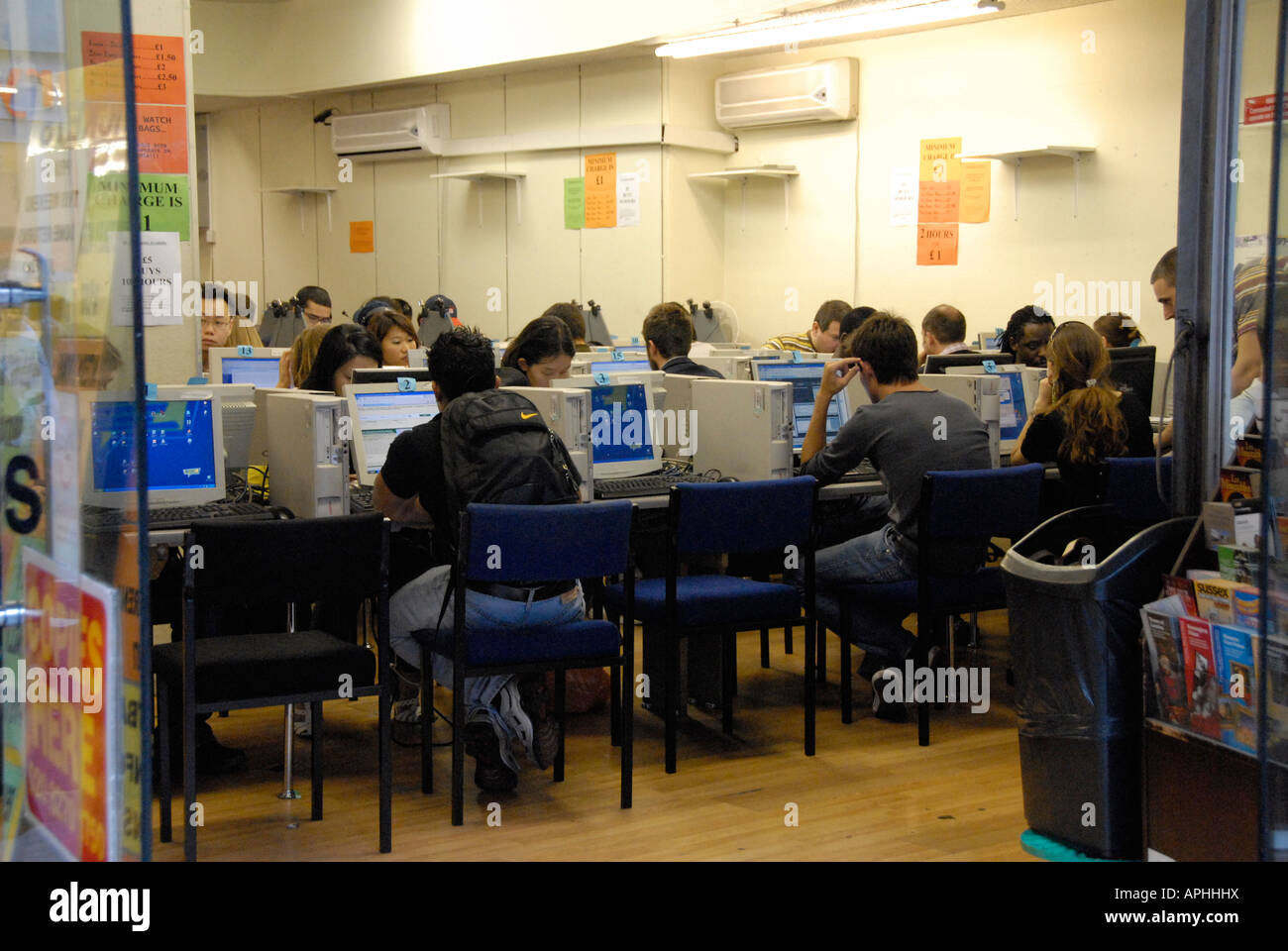 People browsing in internet cafe east London. Stock Photo