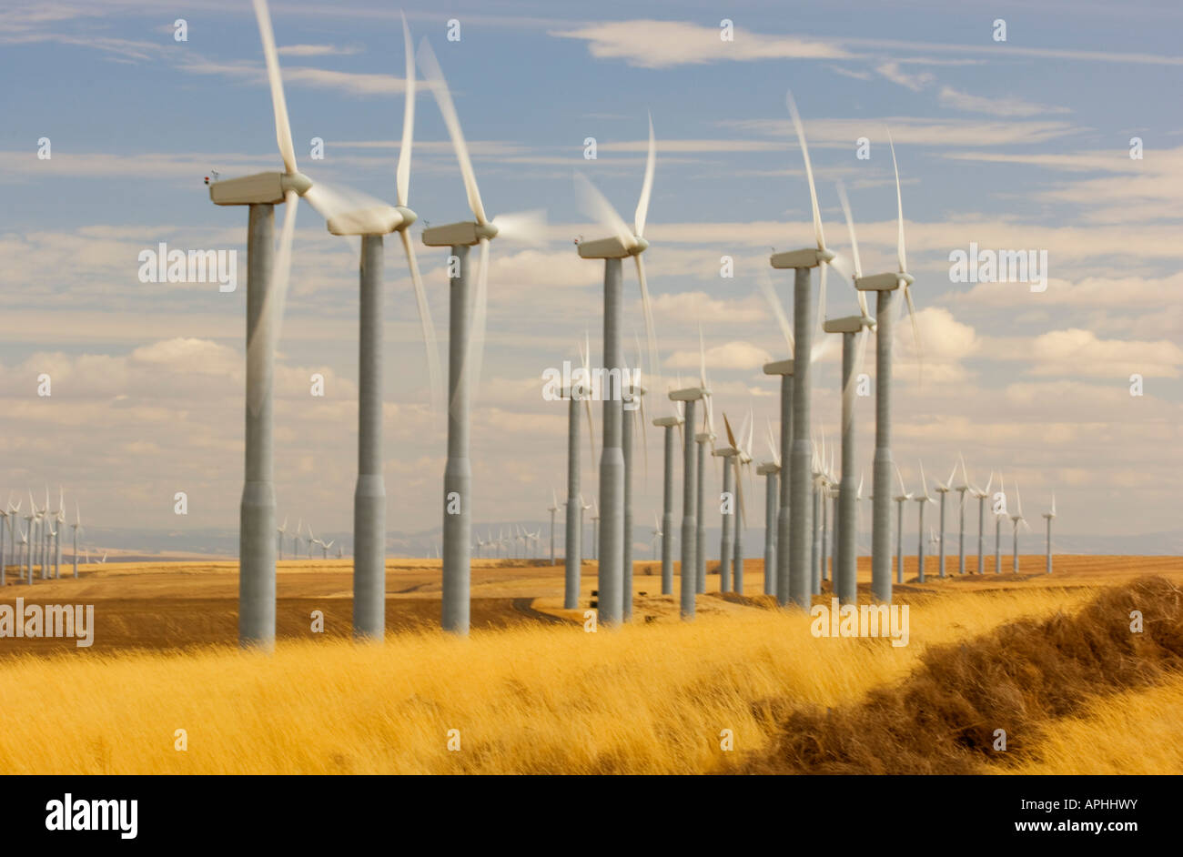 The propellers of wind turbines spin and generate electricity in southeast Washington State Stock Photo