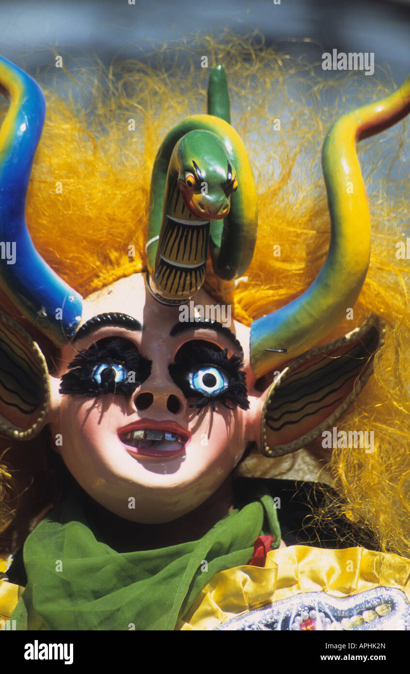 Masked female China Supay dancer in the Diablada, Gran Poder festival