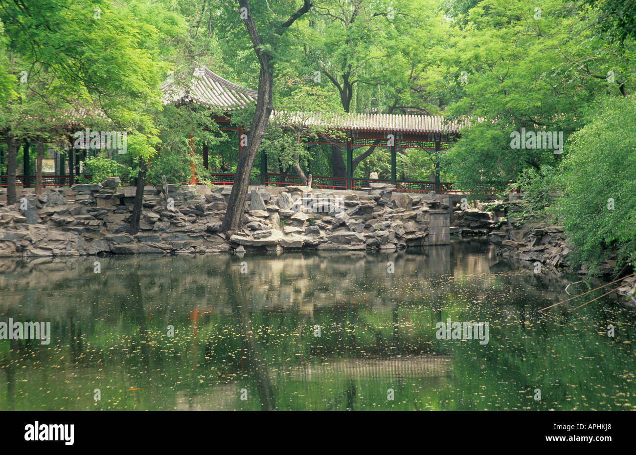 Reflection of the covered walkway through gardens at Song Qing Ling