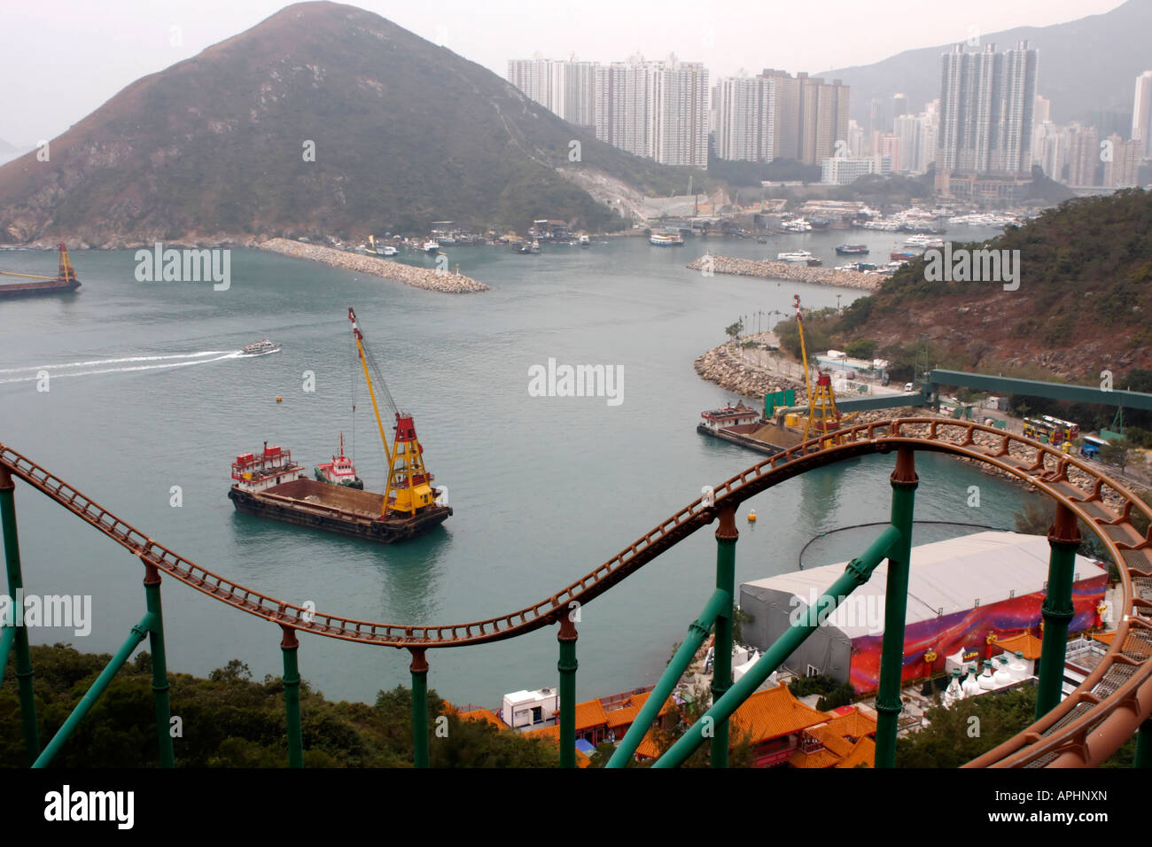Roller Coaster track at Ocean Park, Hong Kong with ships and city in