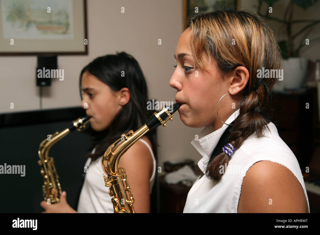 Two girls playing saxophones Stock Photo