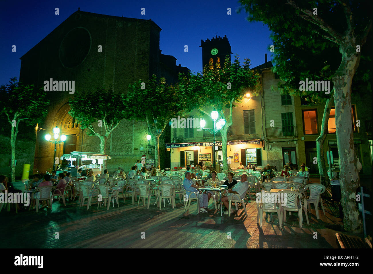 Night time in the main square Placa Major in the town of Pollenca ...