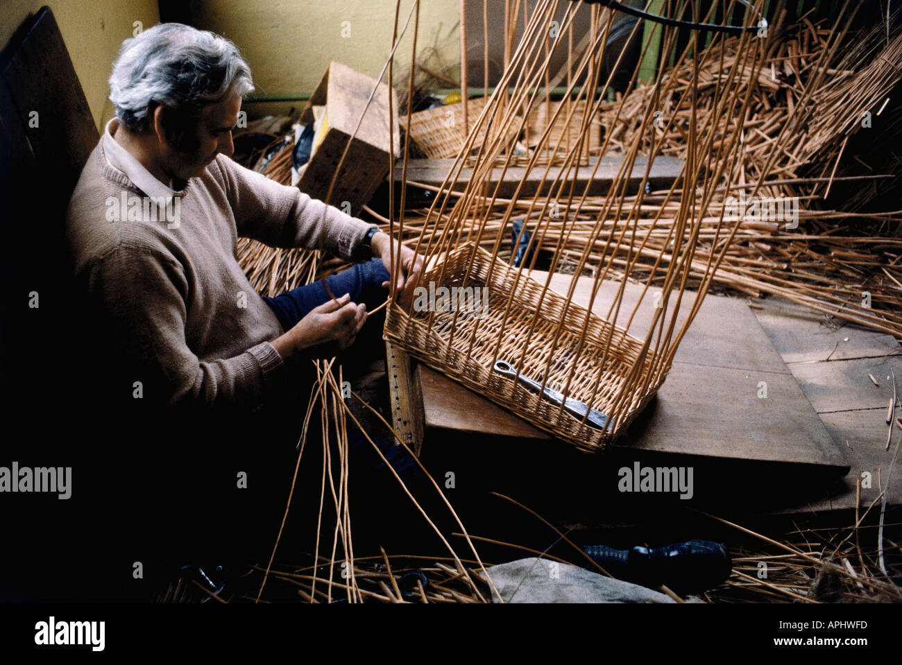 A man weaving a basket in Curry Rivel Somerset England Stock Photo