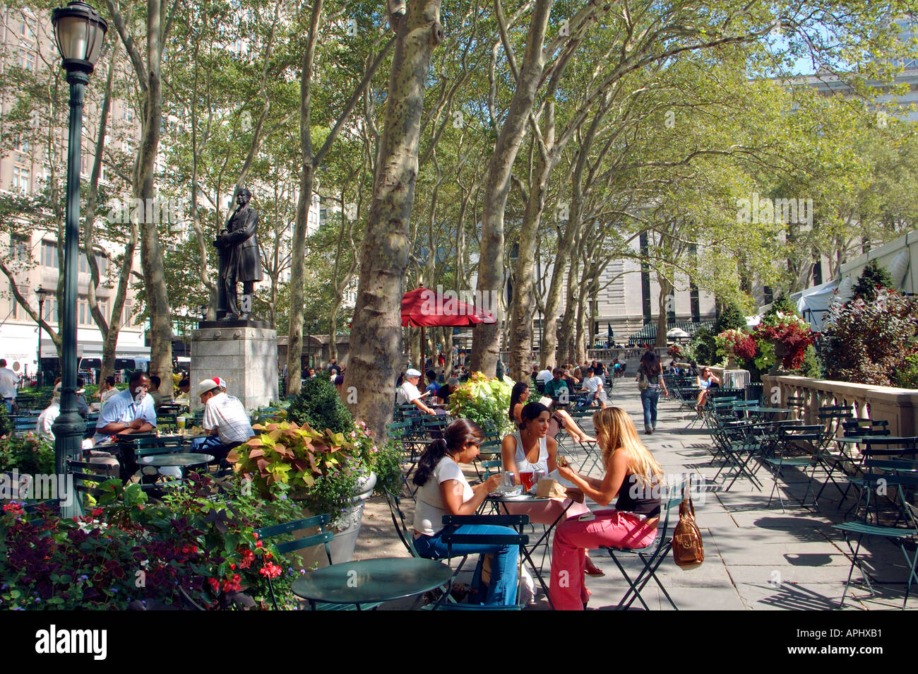 People relaxing in Bryant Park, New York, NYC Stock Photo