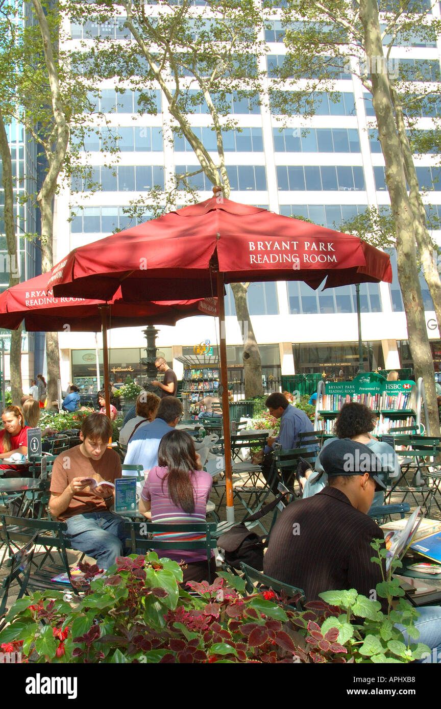 People relaxing in Bryant Park reading room, New York, NYC Stock Photo