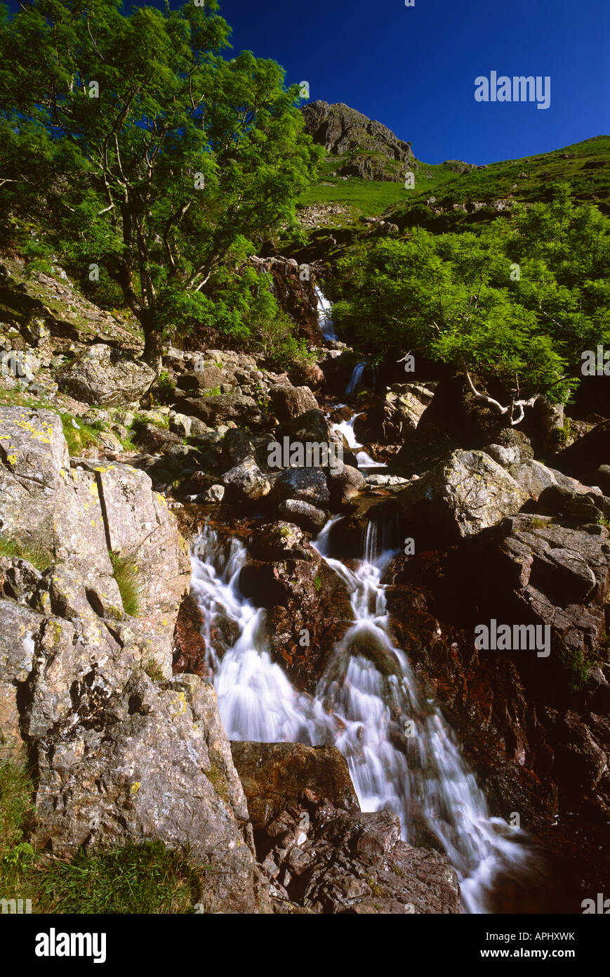 Stickle Ghyll Waterfall leading up to Stickle Tarn near Chapelstile, Lake District, Cumbria Stock Photo
