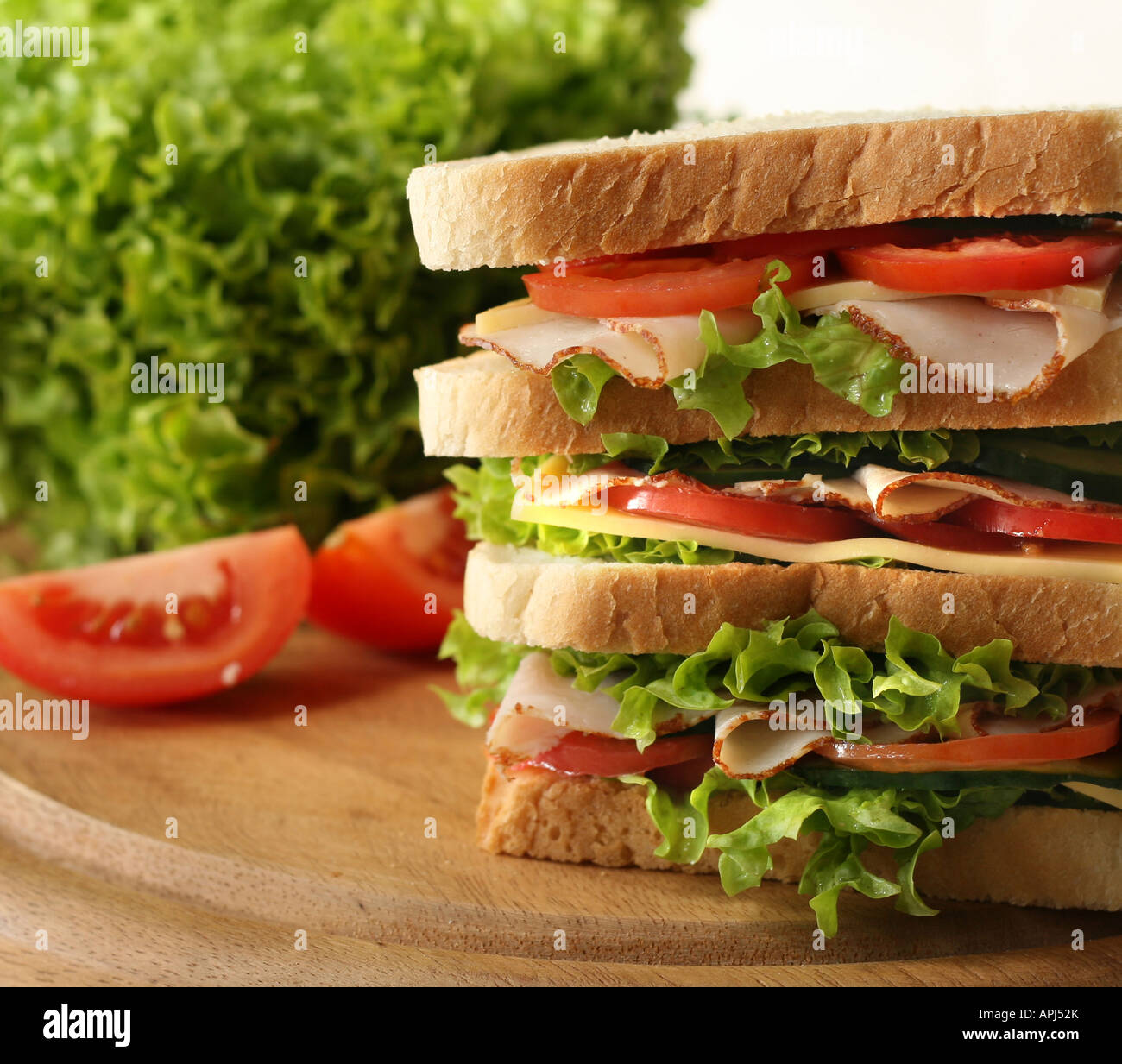 Huge sandwich with fresh ham salat gherkin and tomatoes Shallow depth