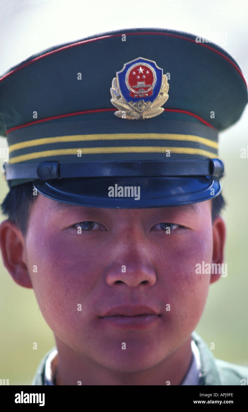 Chinese policeman Immigration at Pirali en route from The Kunjerab pass on the Pakistan China border to Kashgar Xinjiang China Stock Photo