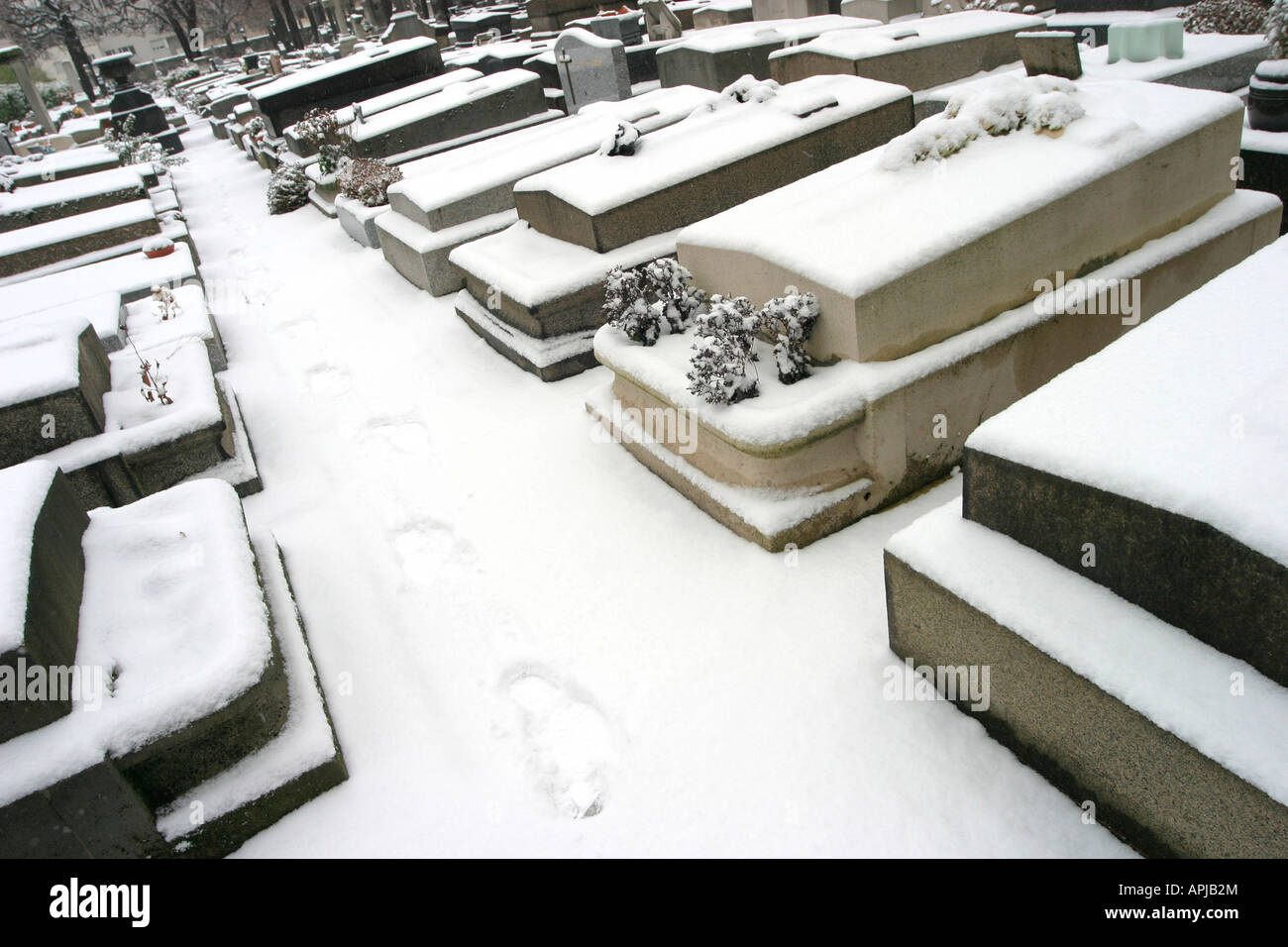 Footprints in the snow Grenelle Cemetery rue St Charles Paris 15th France Stock Photo