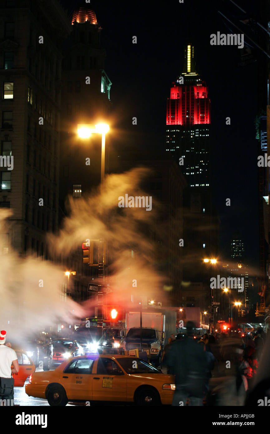 Street scene with the empire state building in Manhattan New York Stock ...