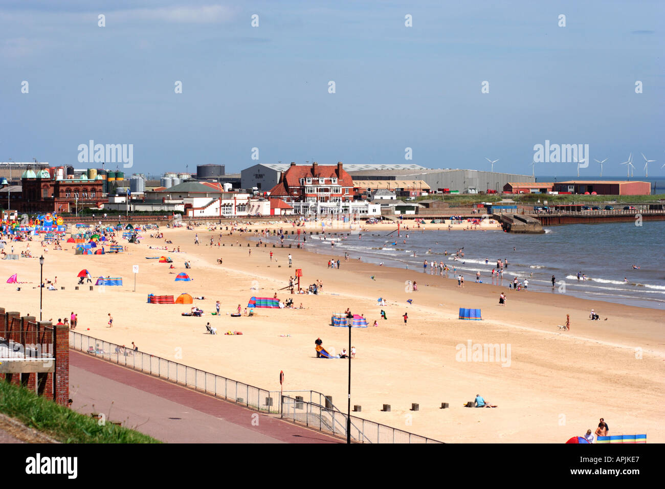 England Norfolk Gorleston beach in the morning sandy beach blue sky pier hotel at rear wind