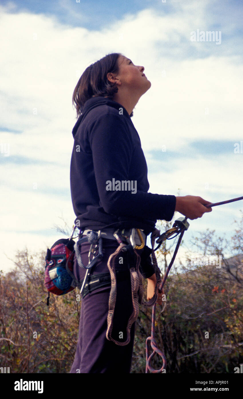 Idaho City of Rocks side view of female rock climber on belay Stock Photo