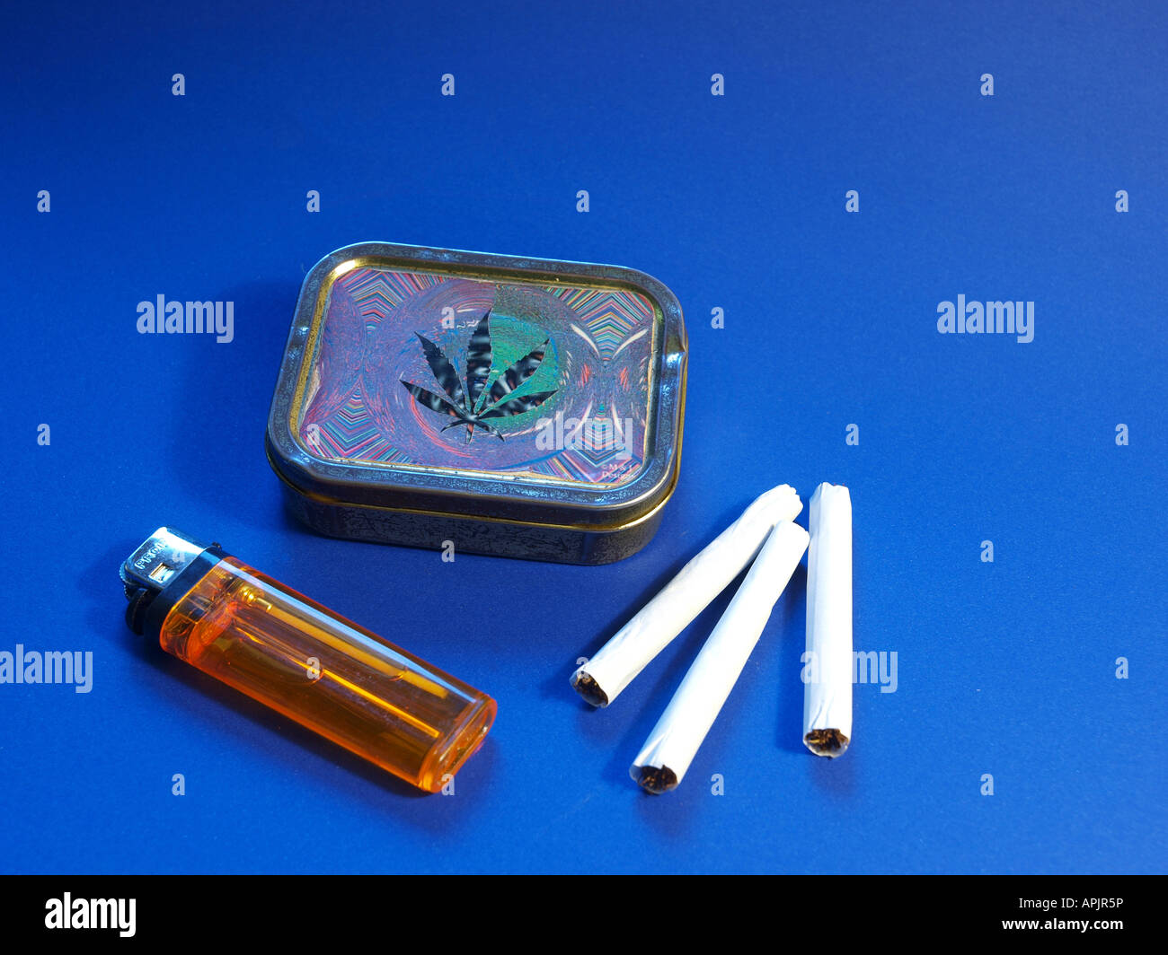 cigarettes, lighter and cigarette box with cannabis leaf Stock Photo