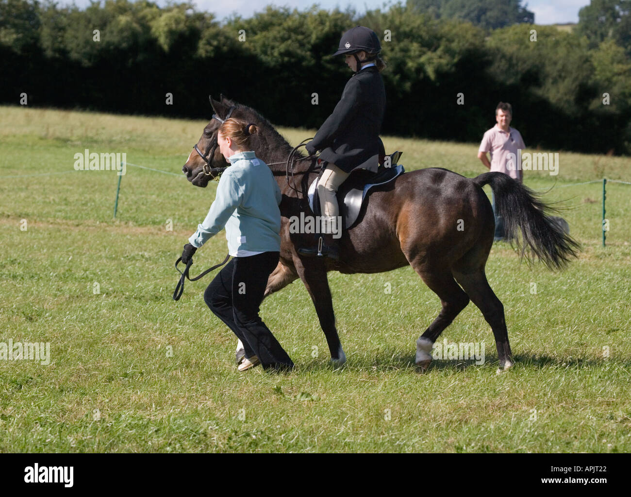 Leading little girl riding horse hires stock photography and images