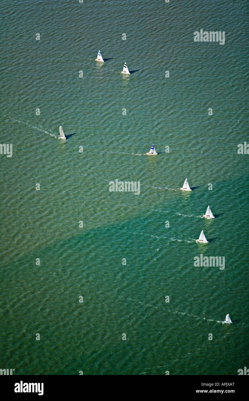 aerial view above sail boats racing San Francisco bay across tide line Stock Photo