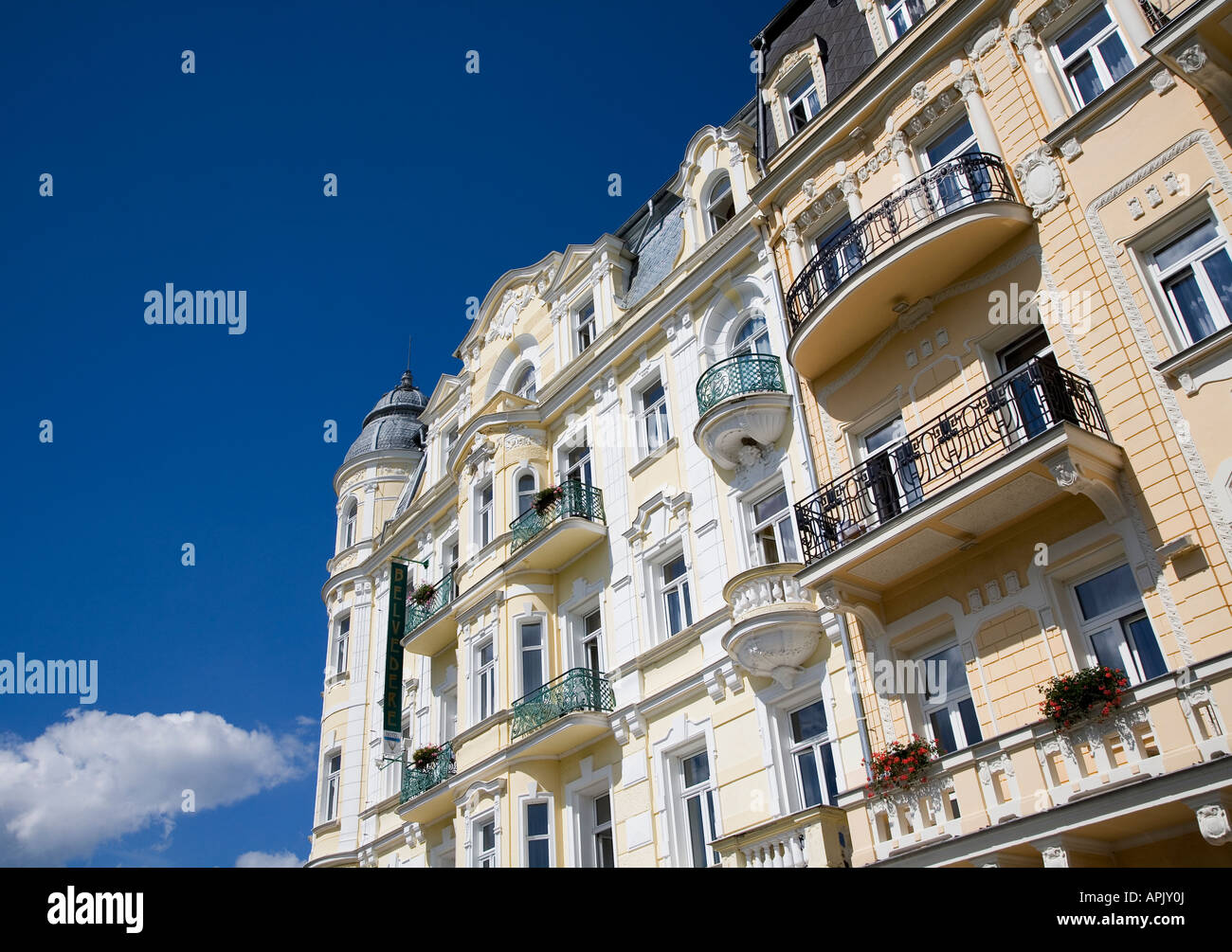 Traditional yellow and white painted hotel Belvedere building in Goethovo Namesti square Marianske Lazne Czech Republic Stock Photo