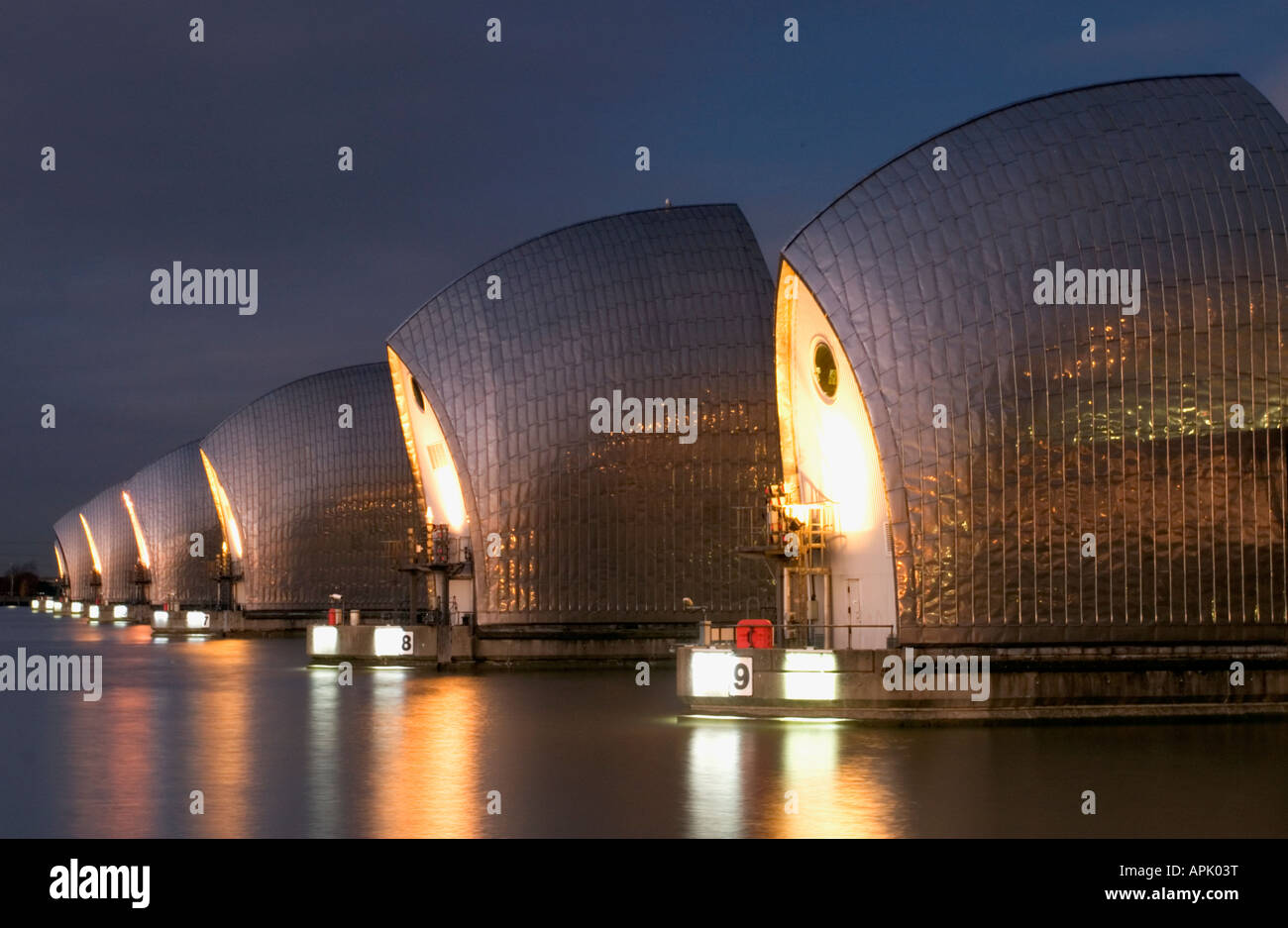 Thames Barrier illuminated at night Stock Photo