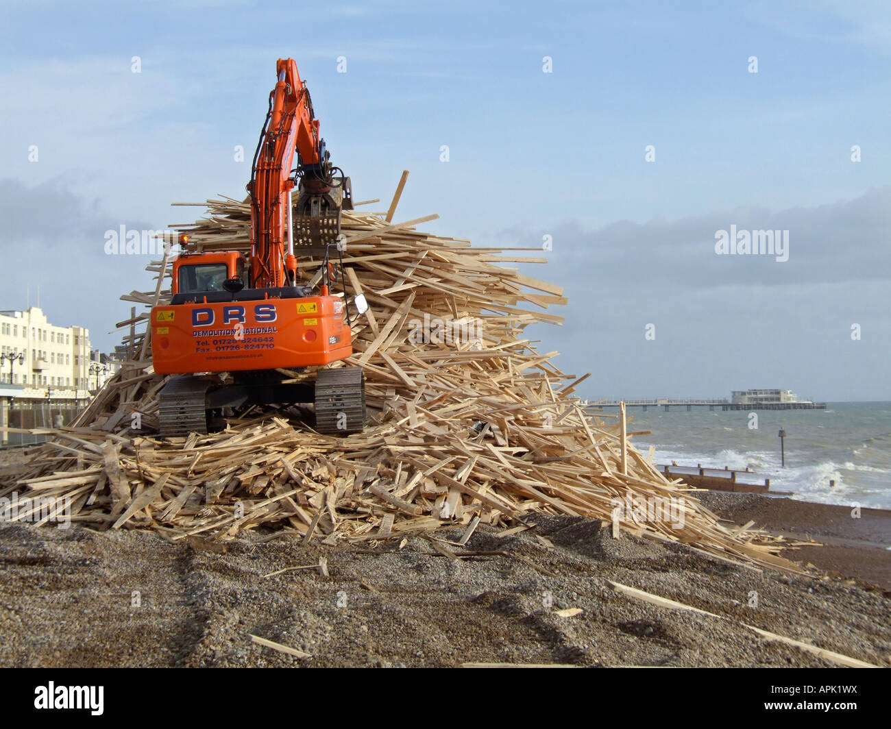 Wood being piled up on Worthing beach after the Ice Prince cargo ship ...