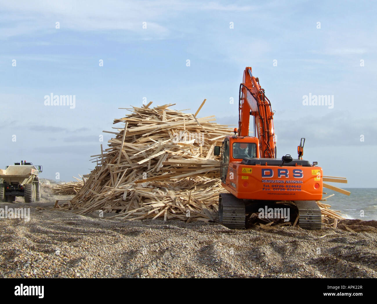 Wood being piled up on Worthing beach after the Ice Prince cargo ship ...
