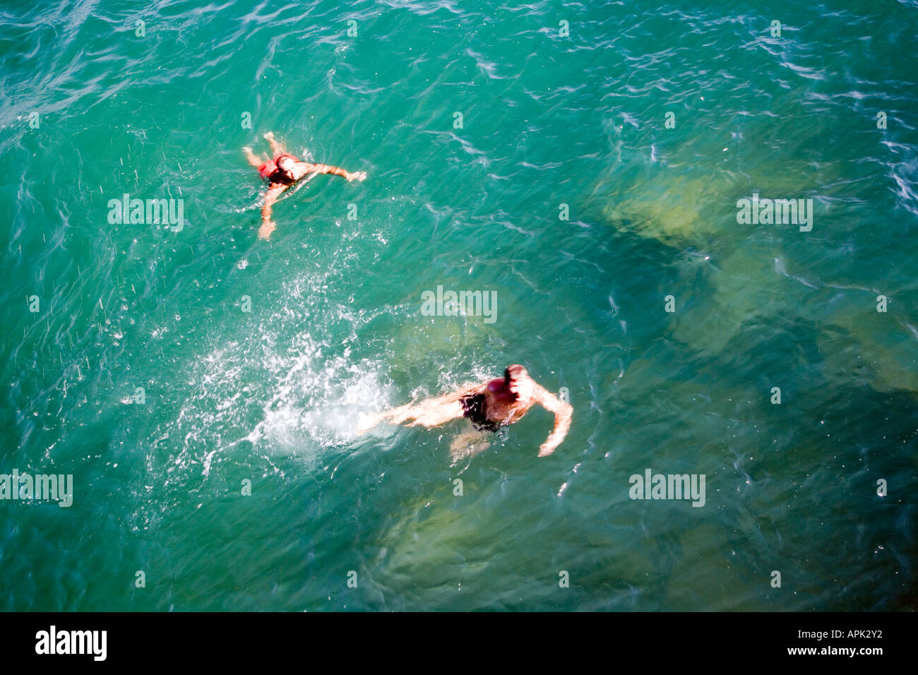 Refreshing image of people swimming on sea Stock Photo - Alamy