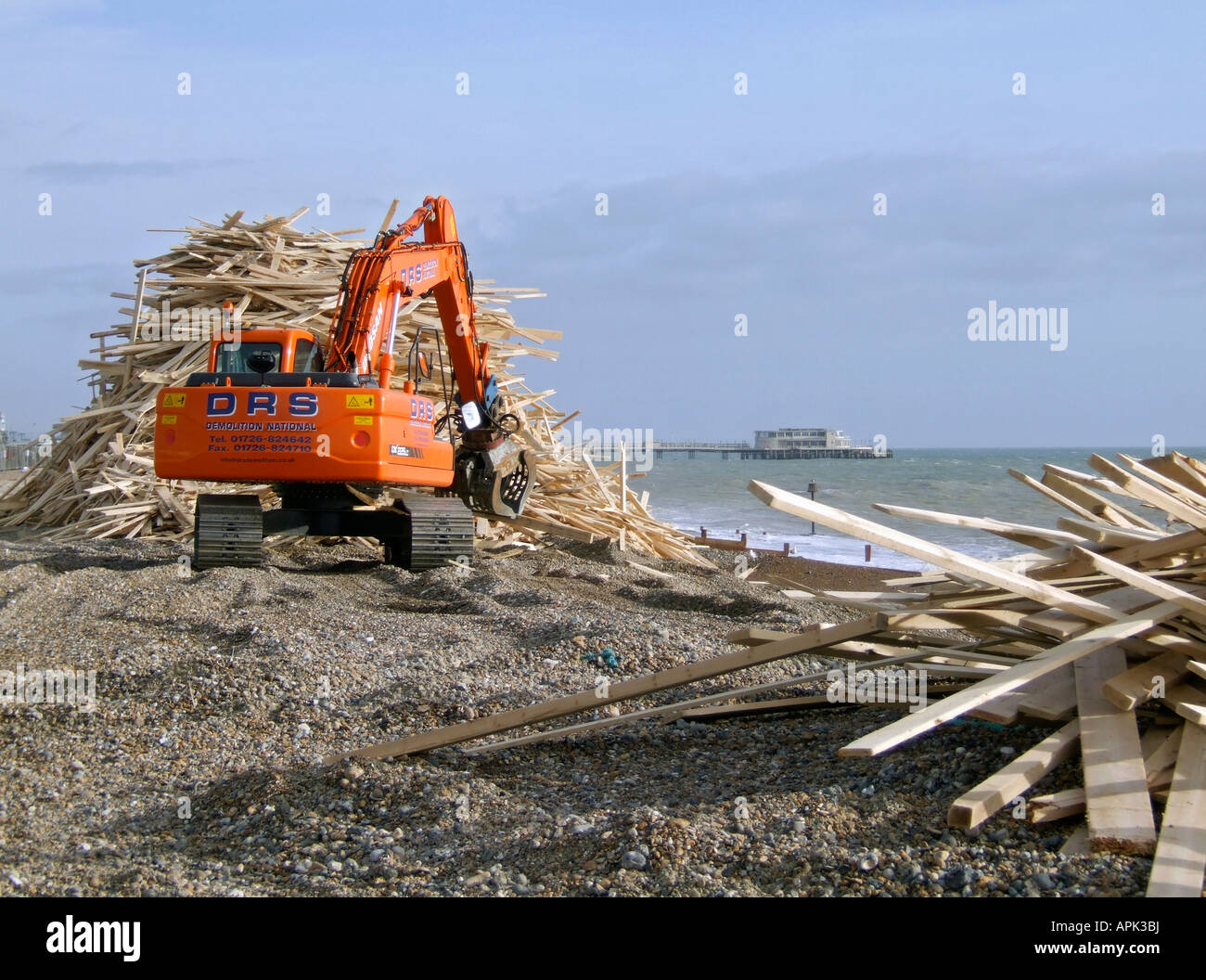 Wood being piled up on Worthing beach after the Ice Prince cargo ship ...