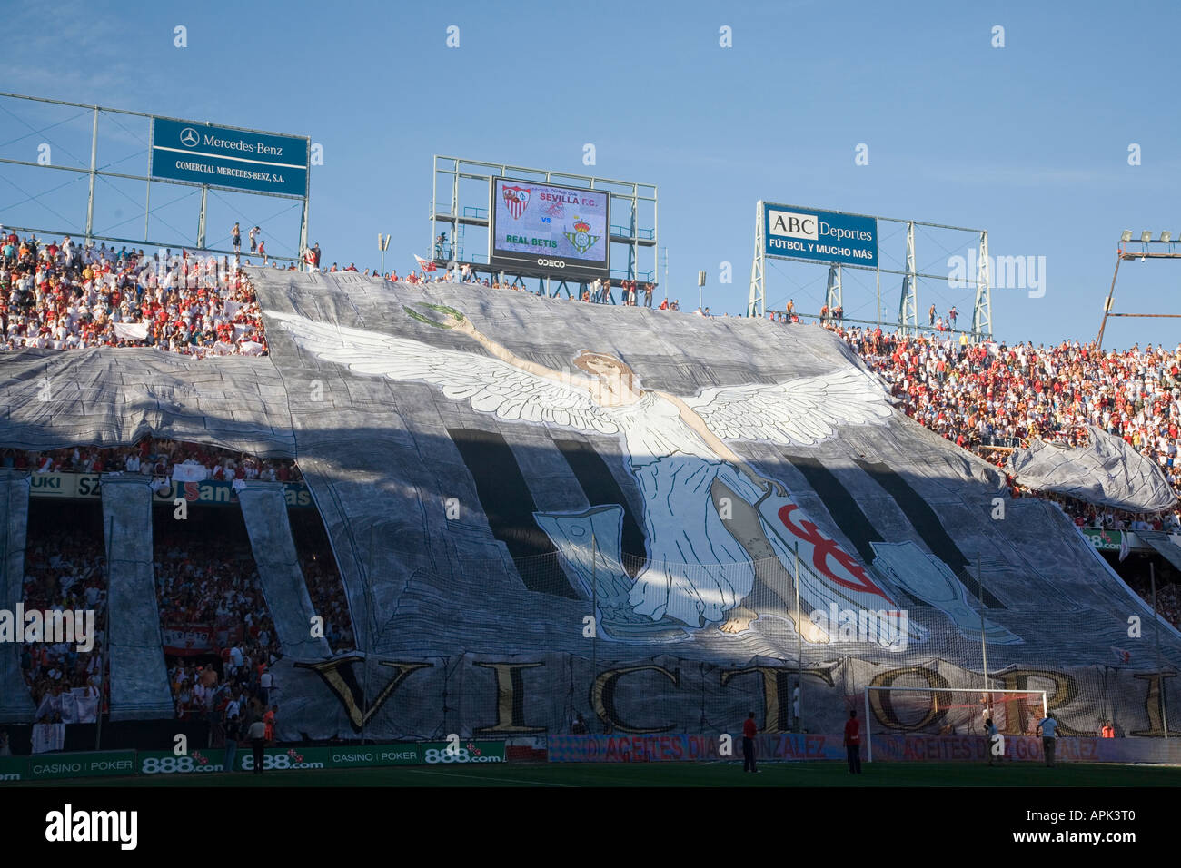 Sevilla FC fans making a huge tifo with a picture of Victory at beginning of local derby against Real Betis Stock Photo