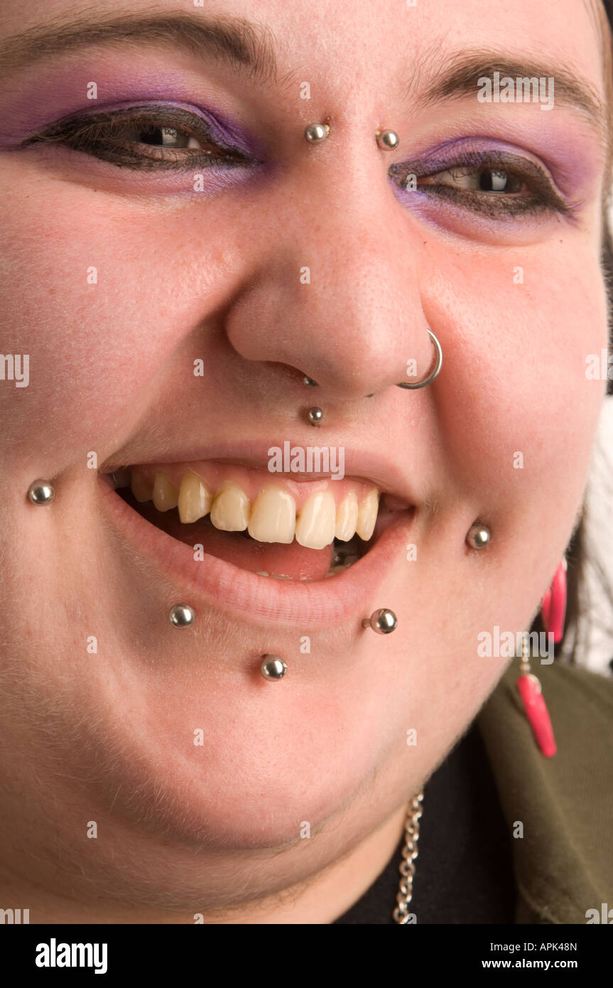 young punk goth welsh woman; she has multiple facial piercings UK Stock Photo