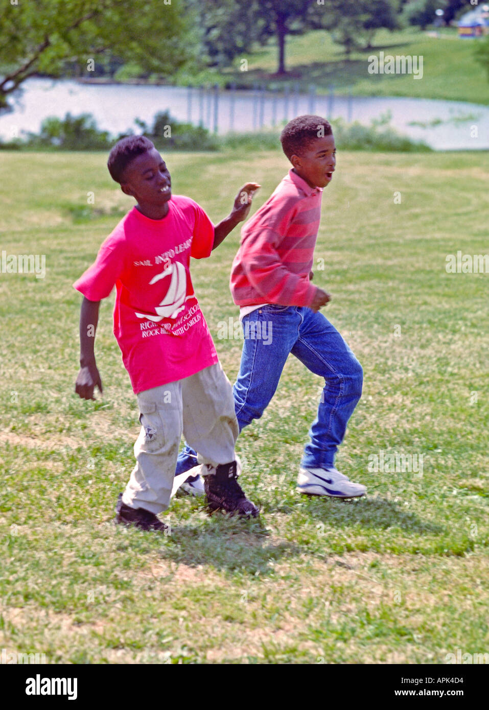 Three legged Race Two African American boys participate in three legged race  on field day Stock Photo - Alamy