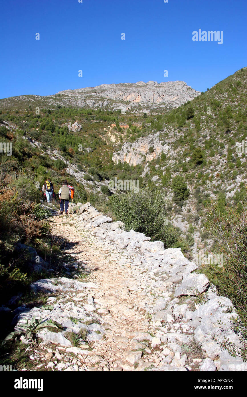 Hikers descending on a Mozarabic Trail in Spain Stock Photo
