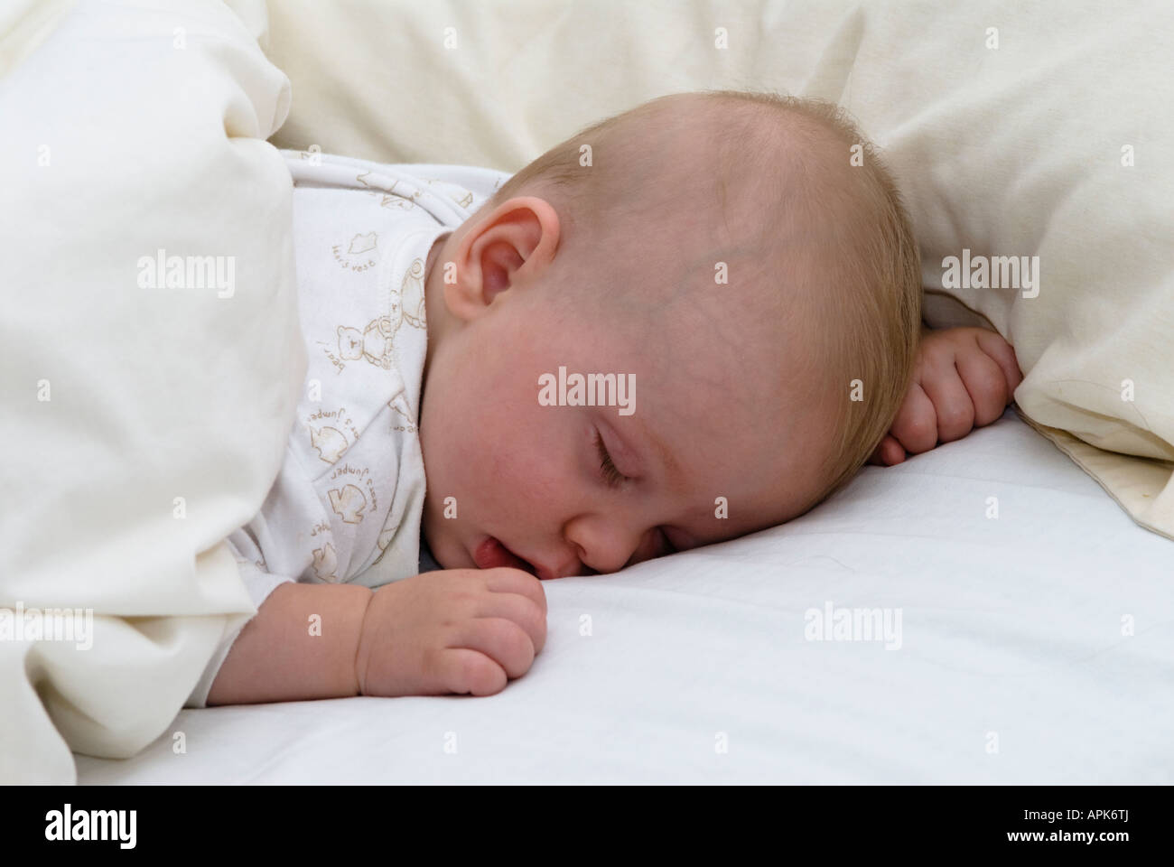 five months old baby asleep face down in bed Stock Photo Alamy