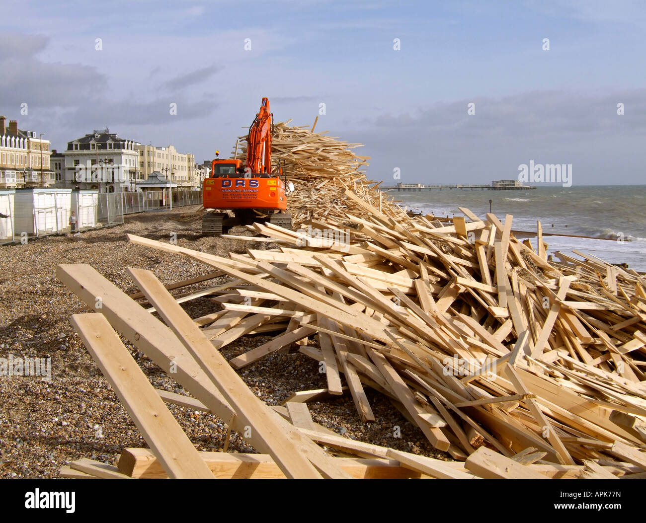 Wood being piled up on Worthing beach after the Ice Prince cargo ship ...