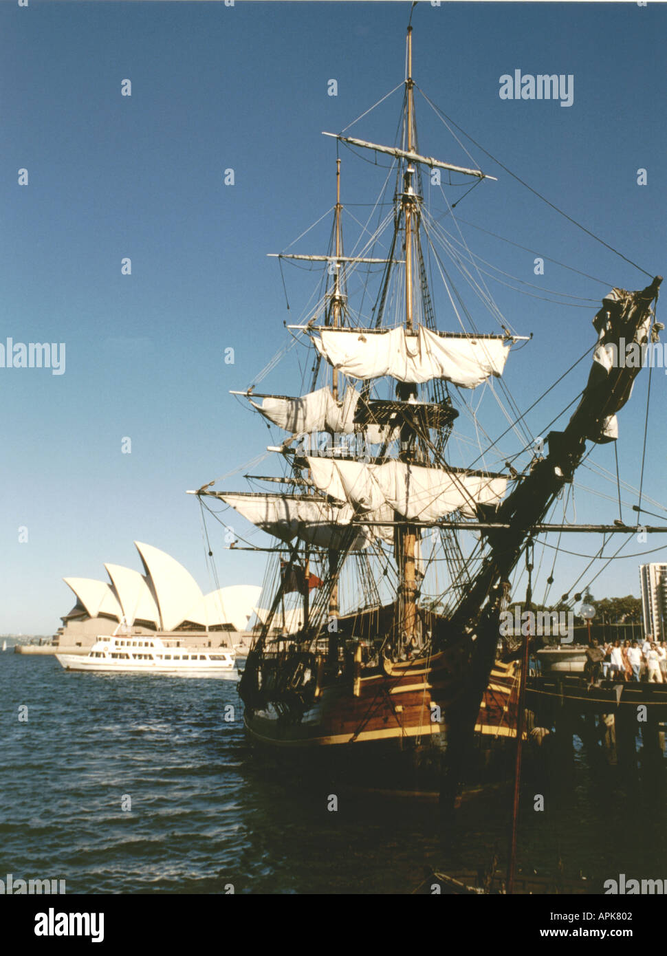 Replica of HMS Bounty Endeavour in front of Sydney Harbour Opera House Stock Photo