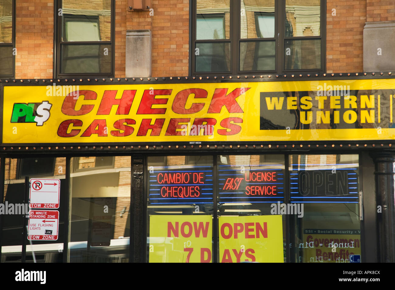 ILLINOIS Chicago Exterior of check cashing store neon signs Western