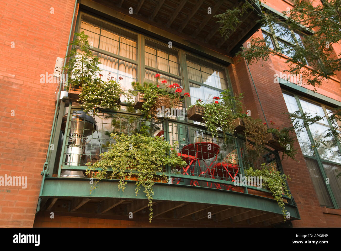 ILLINOIS Chicago Balcony of brick residential building with many plants