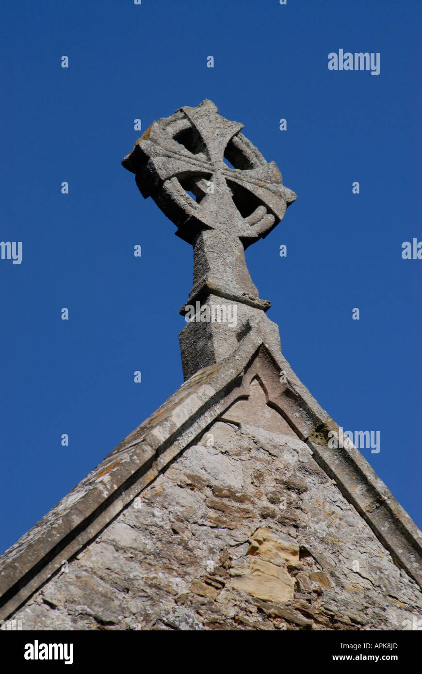 Stone cross on the roof of All Saints Church Staplehurst Kent England UK 08 August 2006 Stock Photo