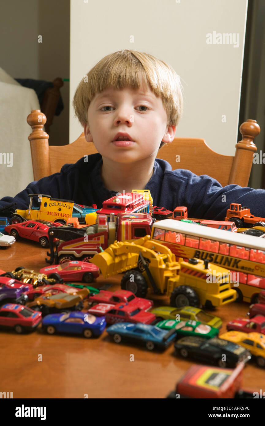 3-year-old-boy-and-his-car-collection-stock-photo-alamy