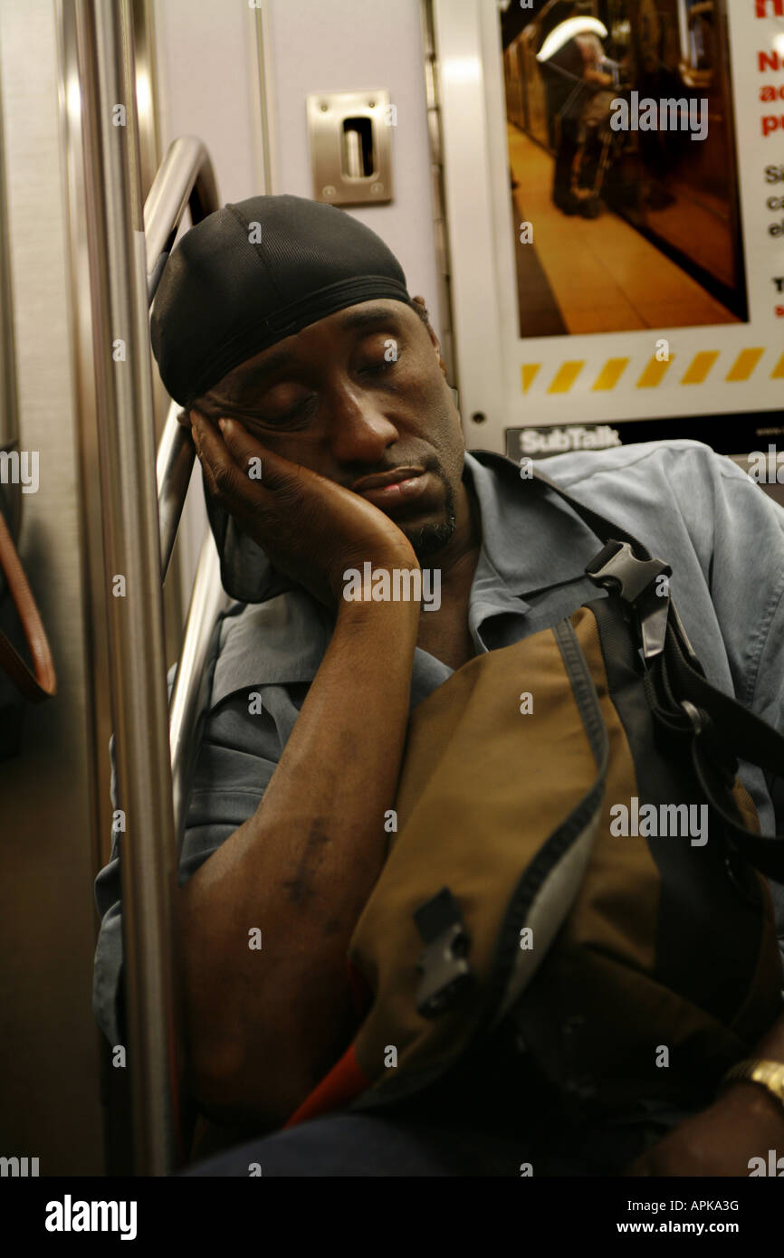 Tired rider New York CIty subway train Stock Photo