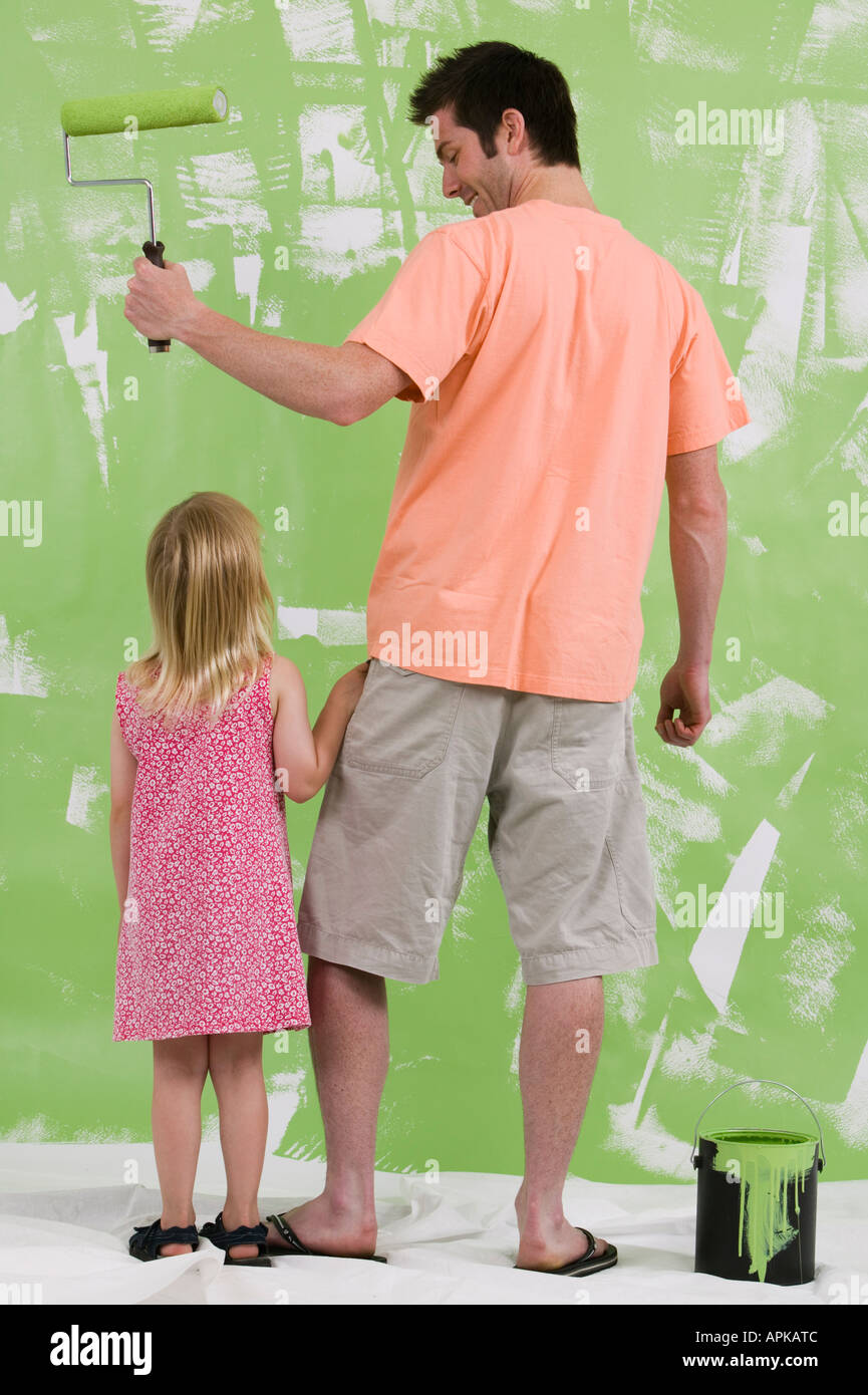 Man House Painting With Daughter Near By Stock Photo