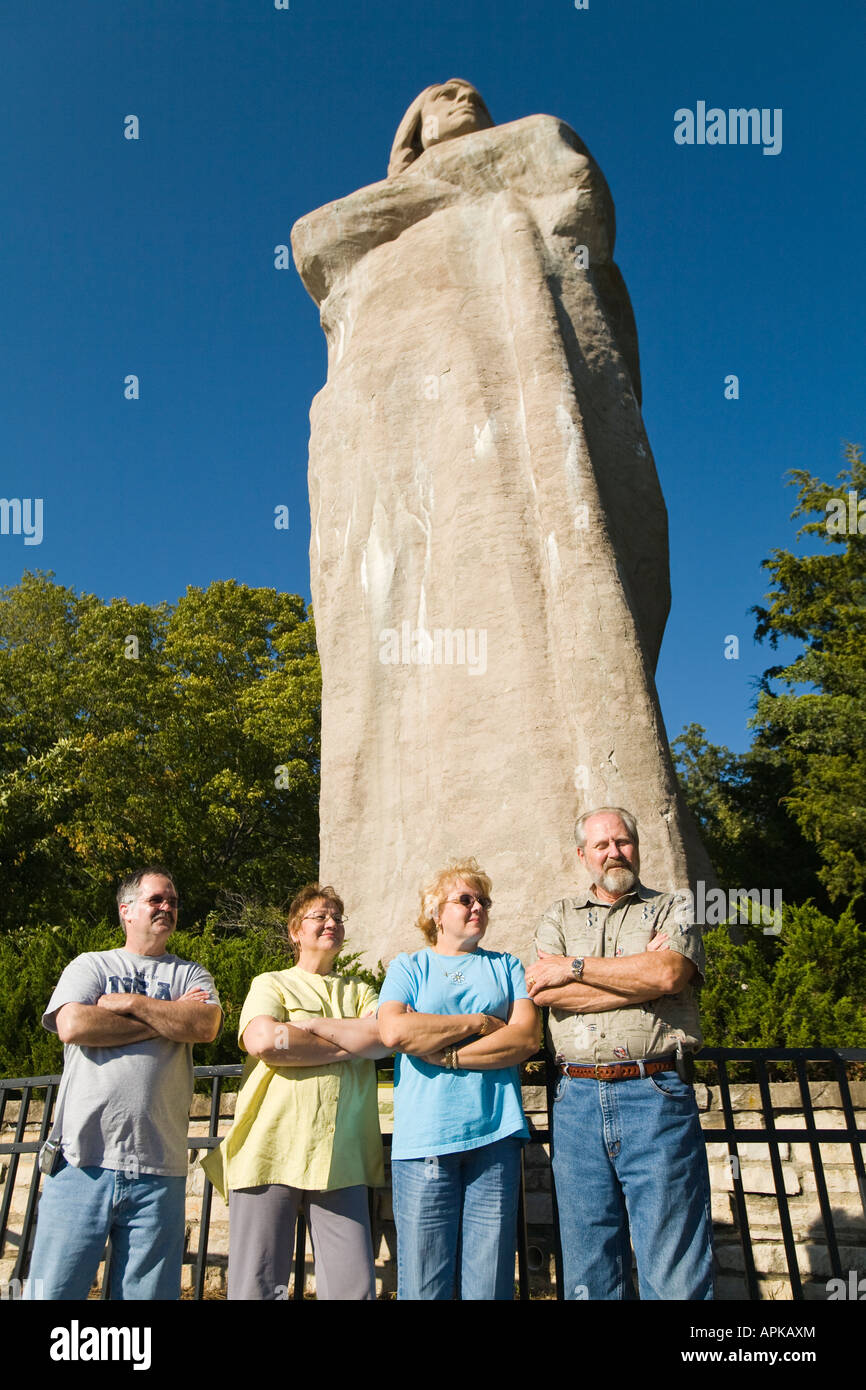 ILLINOIS Oregon Four adults pose by Stone Black Hawk statue designed Lorado Taft American Indian Lowden State Park Stock Photo