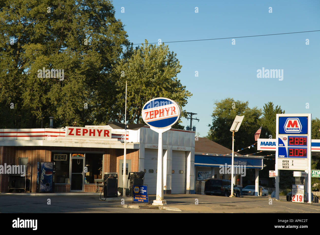 ILLINOIS Dixon Signs for Zephyr and Marathon gas stations along road in small town price signs for gasoline Stock Photo