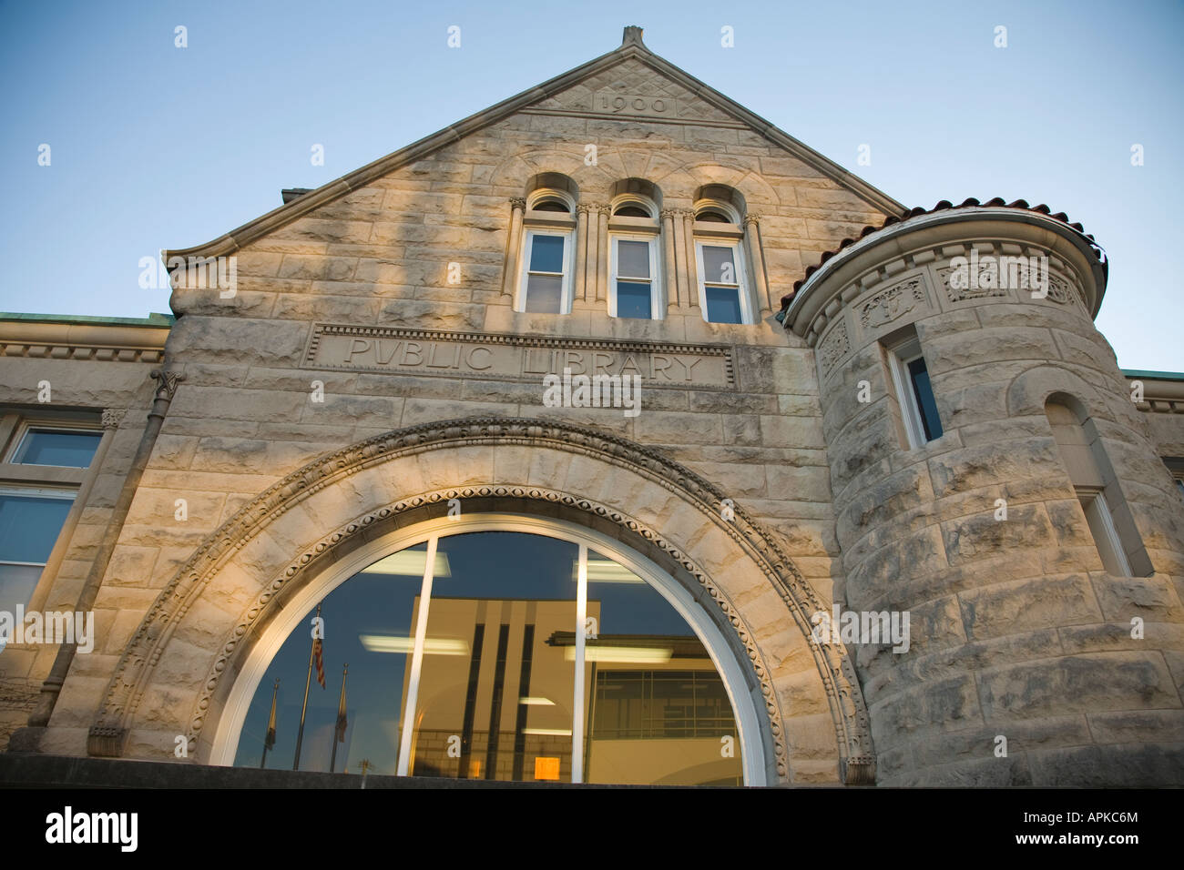 ILLINOIS Dixon Exterior of public library building stone reflection of modern building in window