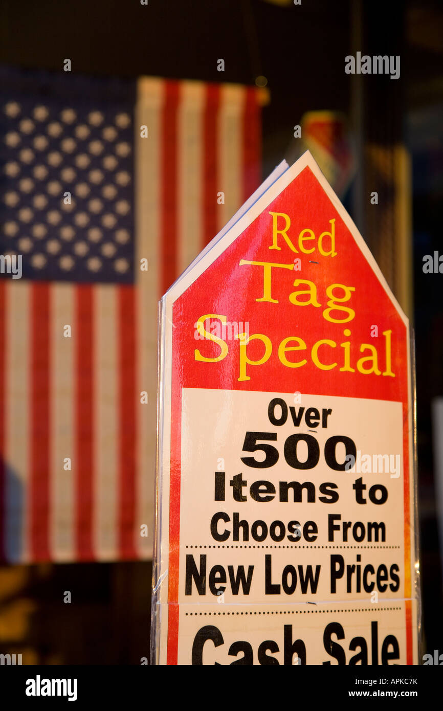 ILLINOIS Dixon Sign for red tag special in retail store low prices American flag hanging in background Stock Photo