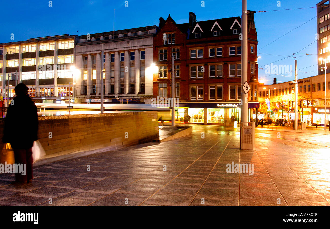 Night time at Nottinghams Market Square. Lights from the local shops