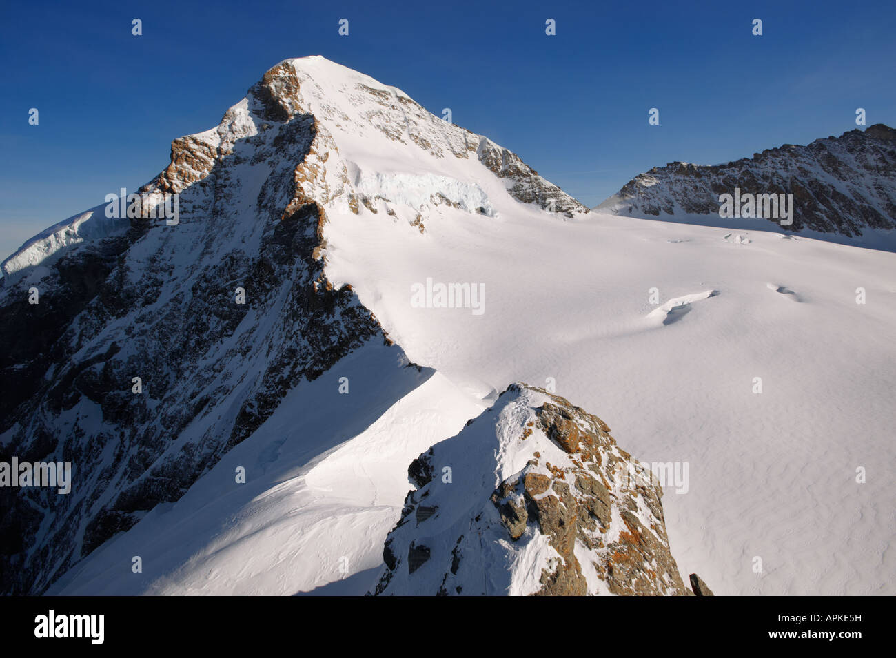 Monch peak from the Jungrfrau Top of Europe observatory, Swiss Alps, Switzerland. Stock Photo