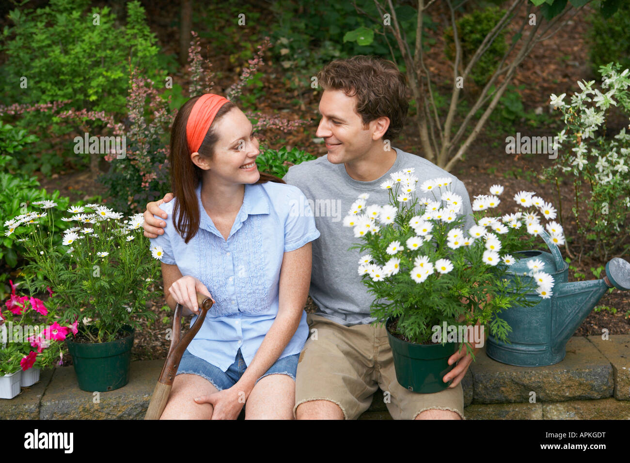 Young couple in garden (portrait) Stock Photo