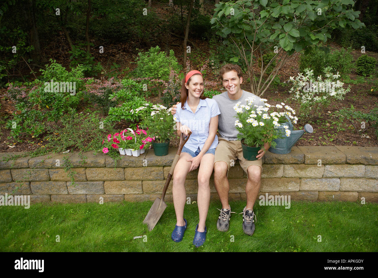 Young couple in garden (portrait) Stock Photo